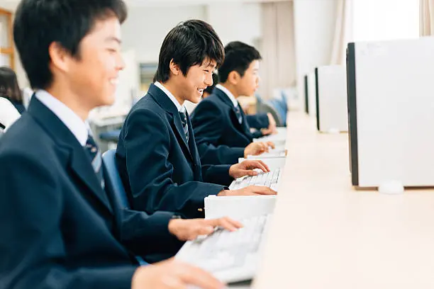 Students learning to code together in a modern computer training lab