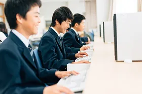 Students learning to code together in a modern computer training lab
